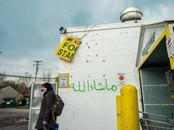 Even the graffiti comforts homesick hearts. Under a dilapidated food stamp sign is an Arabic phrase, "Mashallah," which means appreciation, joy, and praise.
