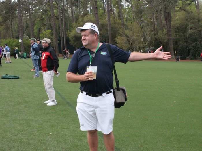 See, here are people having their photos taken in front of the 15th green.