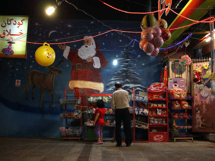 Customers shop at the Father Noel grocery store in Shiraz.