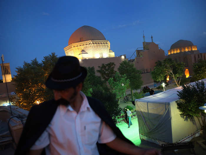 Yazd is known as a center of Persian architecture. The climate forced architects to come up with creative solutions to the heat. Numerous buildings are built with "wind towers" that catch wind and funnel it into the building, providing natural air-conditioning.