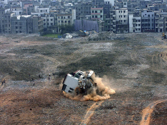 The owners of this nail house in the middle of a construction site in Guangzhou lost a 2008 lawsuit seeking more compensation in exchange for their home.