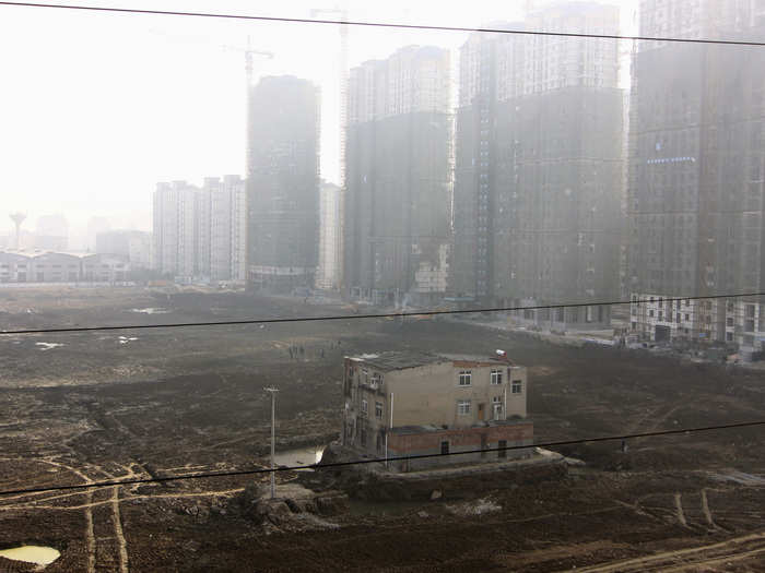 The family that lived inside this nail house in Xiangyang reportedly refused to move because of a disagreement over their compensation. It stands in stark contrast to the high-rises in the background.