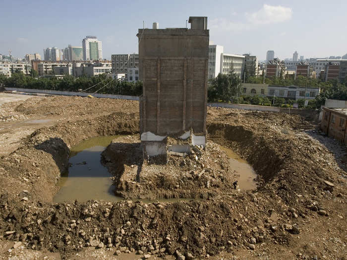 The owner of this partly demolished home in Kunming refused to move, even after water and electricity supplies to the house were cut.