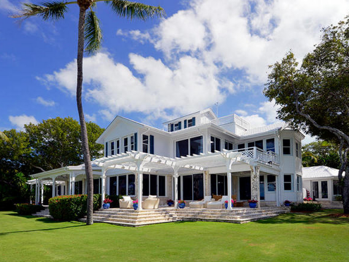 The 2-story main residence has 6 bedrooms, 5 bathrooms, and 3 half baths.