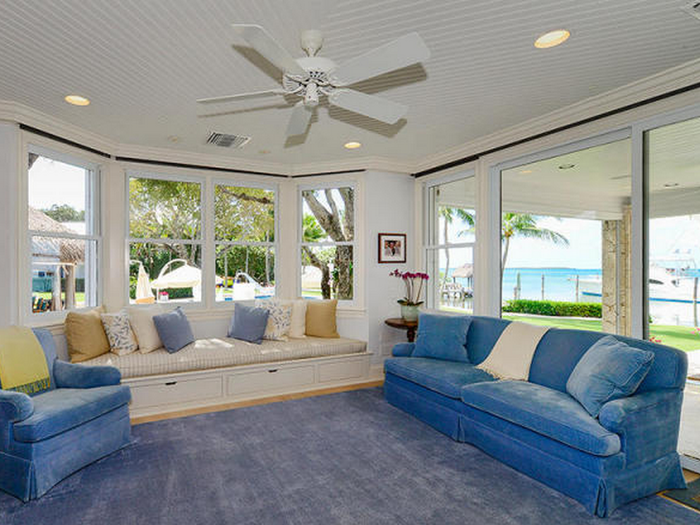 The high ceilings and fans make the living space look like an inviting place to cool off after a day in the sun.