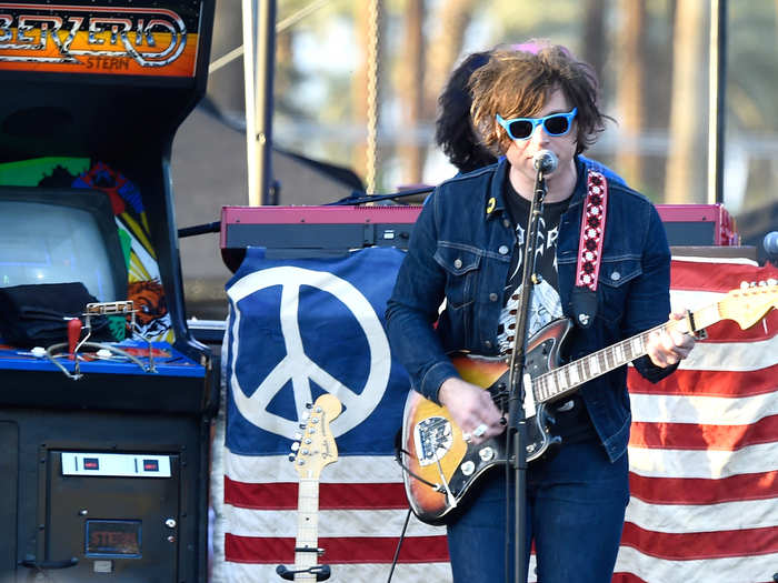 Ryan Adams performed in front of a giant arcade game.