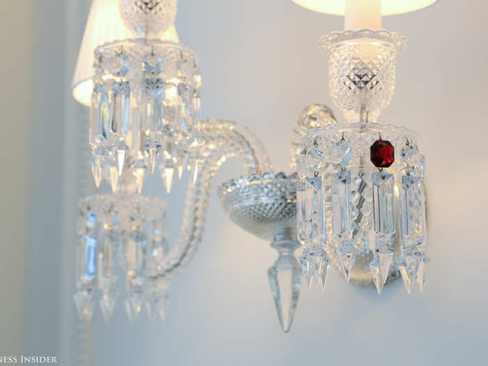 Of course, it features a singular red crystal to match the chandeliers.