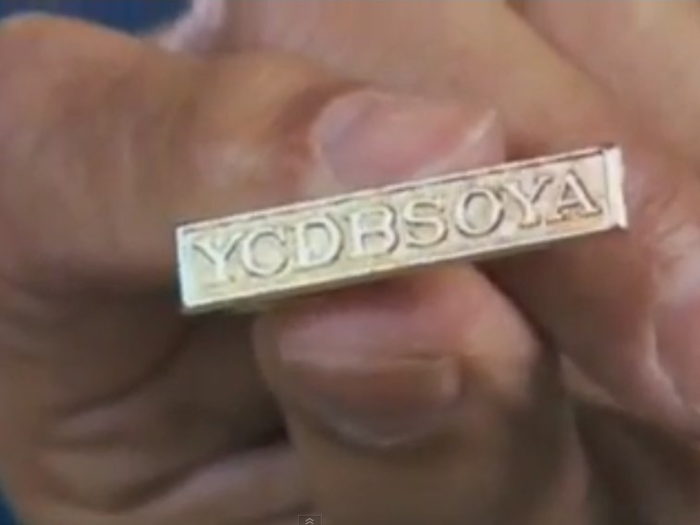 Cohen would give favoured executives this tiepin, with a mysterious motto, "YCDBSOYA."