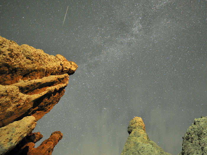 A meteor streaks past stars in the night sky over the village of Kuklici in Macedonia.