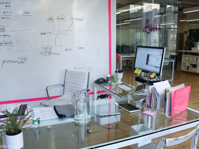 She splits her time between the main office area and this room, which has large white boards she can take notes on.