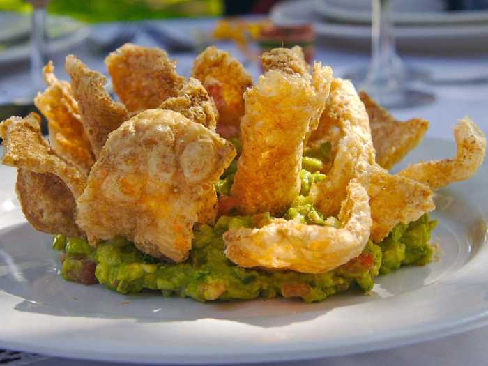 Chicharrónes are crispy fried pork rinds, which can be made either from pork skin or fried pork belly.