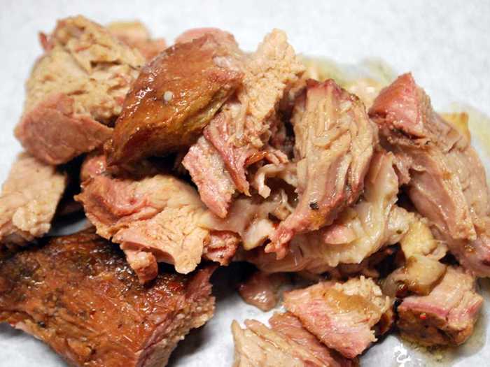 Lechon asado is a classic pork roast that is prepared by roasting a whole pig until the skin is crispy. The meat is often served with mojo sauce, a spicy Cuban marinade.