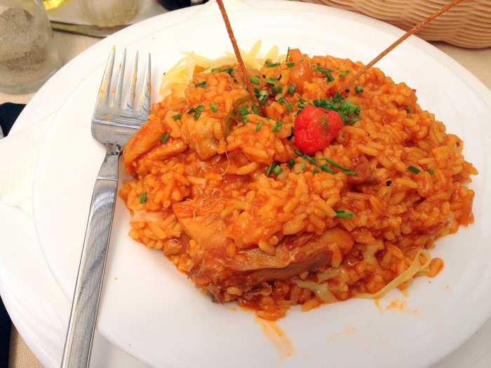 A favorite chicken dish in Cuba, arroz con pollo is similar to paella, but without the seafood. The dish features rice and chicken with a traditional sofrito base.