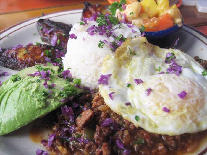 Picadillo cua cua is the Cuban version of hash and eggs. Commonly served with rice, the meal features beef hash, eggs, and plantains.