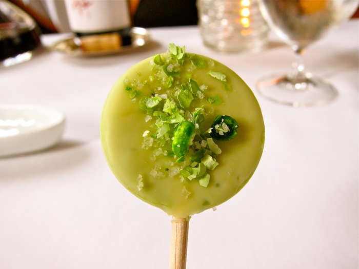 The garden pea and mint lollipop arrives in a glass vase filled with grass.