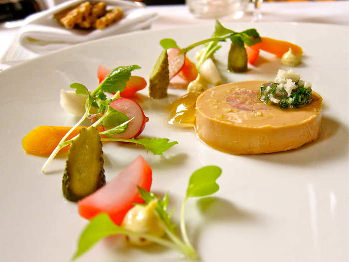 Another gorgeous foie gras preparation, this melt-on-your-tongue foie gras torchon accompanies tête de cochon, pickled spring vegetables, and horseradish.