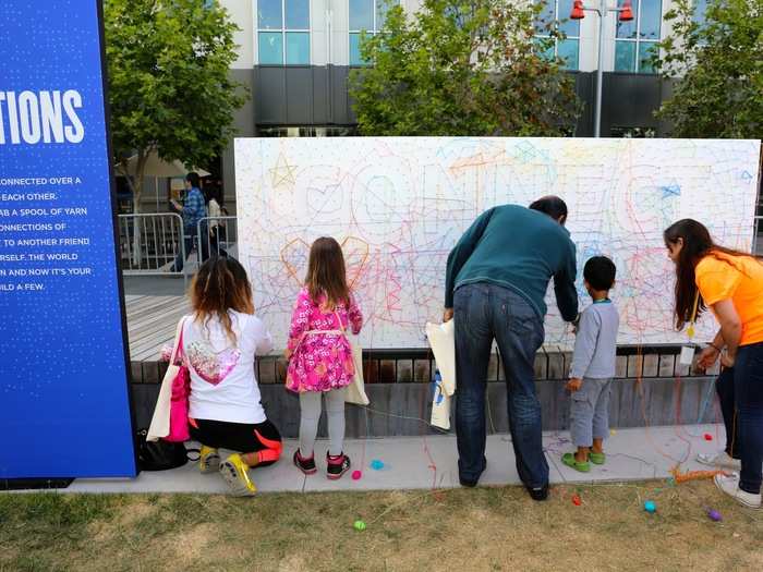 For the slightly older set, Facebook put up an interactive art exhibit where kids could spell out words by stringing yarn around pre-installed nails. One spelled "connect," while another said "be open."