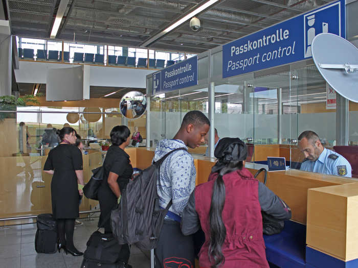 Passengers must go through German immigration and passport control, even though they are entering a US military base.