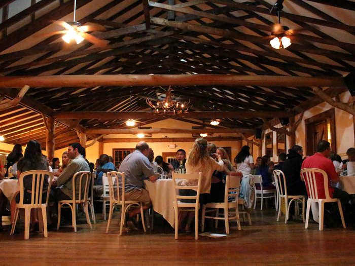 We adjourned into two large dining rooms to feast on wine, fresh bread, a veggie and potato medley, and chicken Parmesan, prepared by chefs from the Connecticut Culinary Institute. I sat with one couple, one staffer, and four solo guests, and I quickly noticed that people who sat on the bus together situated themselves at the same tables.