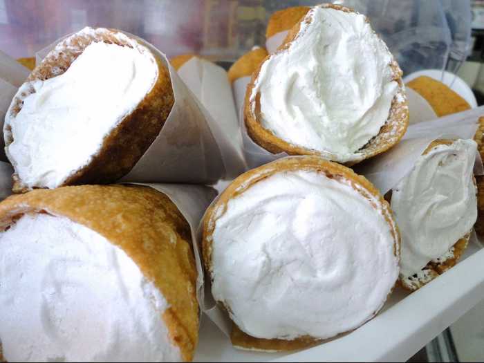 Gaznates offer a light and airy dessert.  The thin waffle cones are filled with a dollop of a creamy merengue custard.