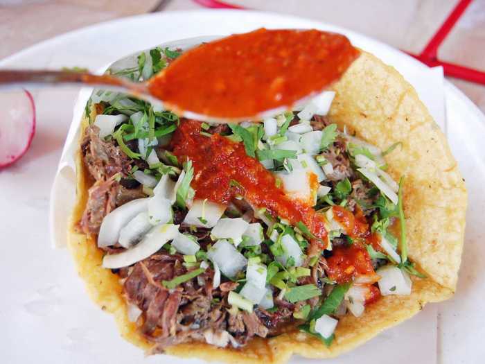 Tacos de Cabeza are tacos made from the head of a cow. The head is steamed overnight and then meat is shredded and stirred with its broth.  Customers can choose from from options like the sesos (brains), the ore (ear meat) and the lengua (tongue).