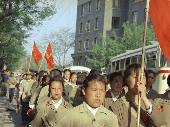 Red Guard units, or paramilitary youth factions mobilized during the Cultural Revolution, marched into the center of the Chinese capital with placards and banners.