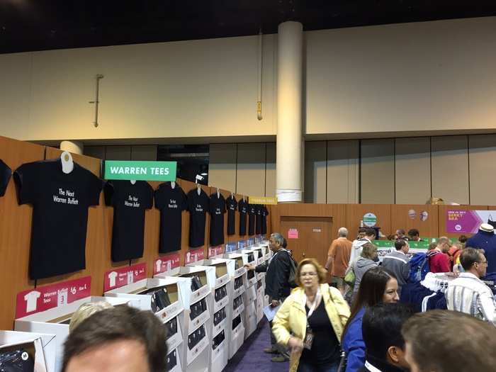 At the end of this row are, "The next Charlie Munger" t-shirts.