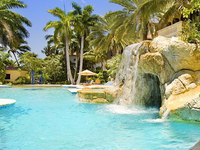 The pool even has a waterfall and mini grotto.