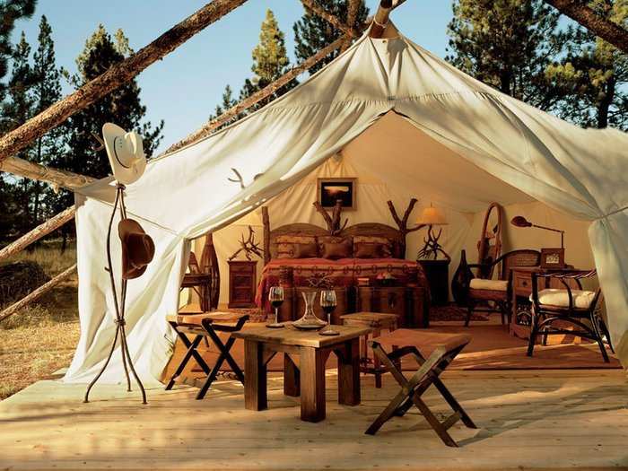 Go glamping (glamorous camping) at the Resort at Paws Up, a luxury retreated located on a 37,000-acre authentic working cattle ranch in western Montana.