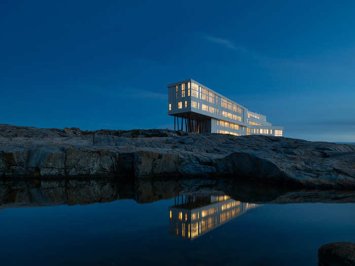 Stay in the ultra-modern Fogo Island Inn, which is perched on stilts atop jagged rocks on the northern coast of Newfoundland, Canada.