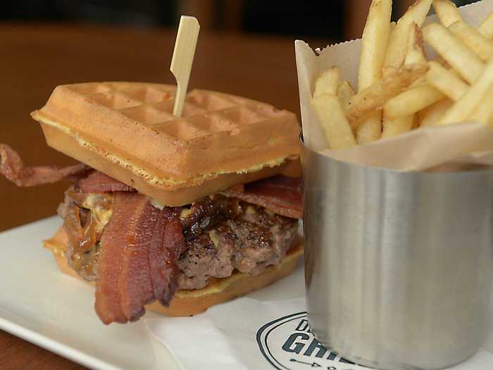 Houston, TX: The Prime Beef Waffle Burger is a sweet-and-savory mix of bourbon-glazed chipotle onions, thick-cut bacon, smoked cheddar and brie cheese, and "sloppy sauce."