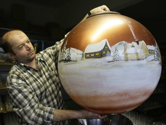 Franz Paternosta hold up a Christmas tree bauble in the Bavarian glassblowing company Joska on December 17, 2008. The company produced the world