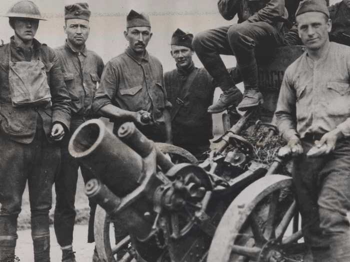 WWI marked the beginning of trench warfare and poison gas. Mortars were useful in muddy trenches because a mortar round could be aimed to fall directly into trenches unlike artillery shells. These Marines are posing with a German trench mortar captured in France in 1918.