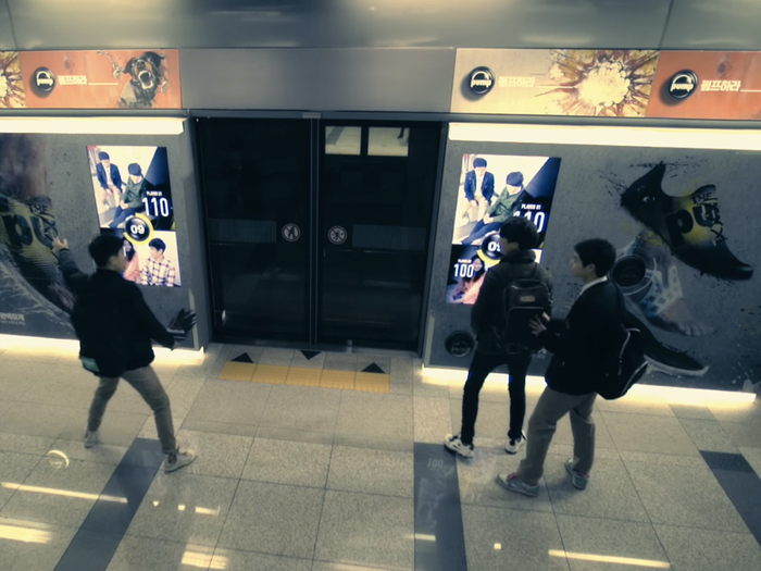 Commuters in a Korean subway station were randomly pitched against each other by this billboard (which took pictures of them and flagged them up on the screen as "Player 1" and "Player 2") to take part in a reaction race, tapping buttons on the wall and floor in front of them as they lit up on the screen. The lucky winners saw the screen pull back in front of them to reveal a free pair of Reebok ZPump sneakers. The campaign was created by agency Innored.