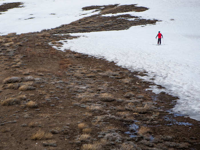 A skier approaches the edge of the snow in Lake Tahoe in March.