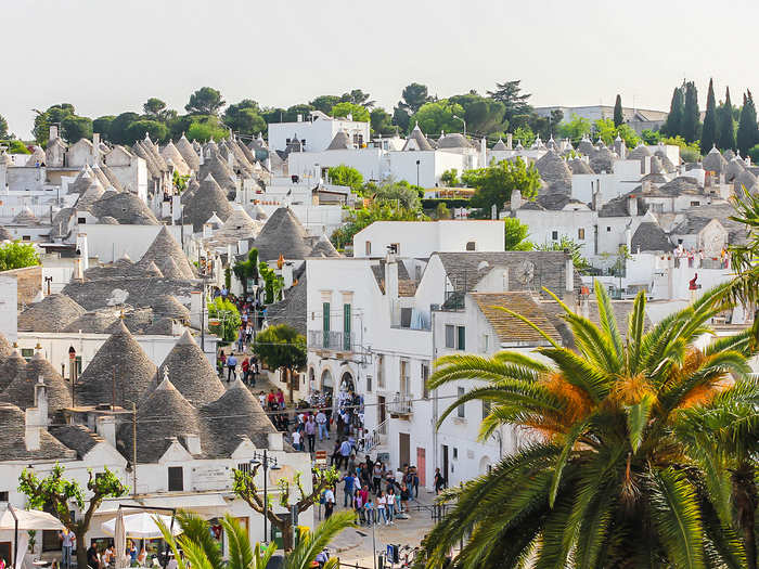 Nestled in the geographical heel of Italy, the picturesque village of Alberobello is home to mouthwatering peasant cuisine, the "kindest people in all of Italy," and white-washed limestone dwellings famous around the world for their cone-shaped roofs.