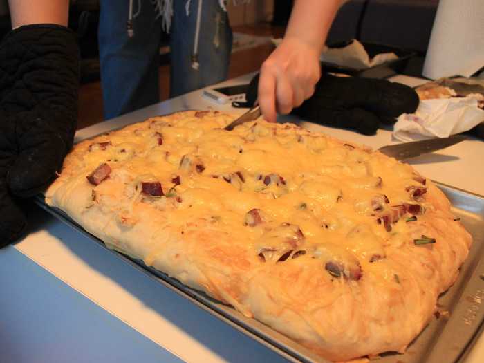 The next pizza was a cheddar, kielbasa, and sauerkraut pizza with a chewier, thicker dough.