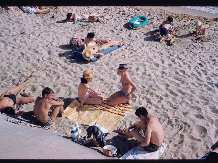 Men, women, and children would regularly go to relax on the beach in Cannes on Sunday afternoons.