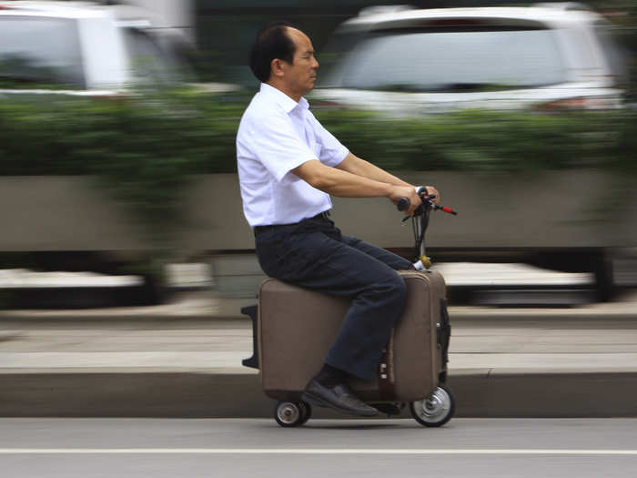 He Liang went for the minimalist option and spent a decade turning a suitcase into a motor-driven vehicle. It has a top speed of 20km/h.