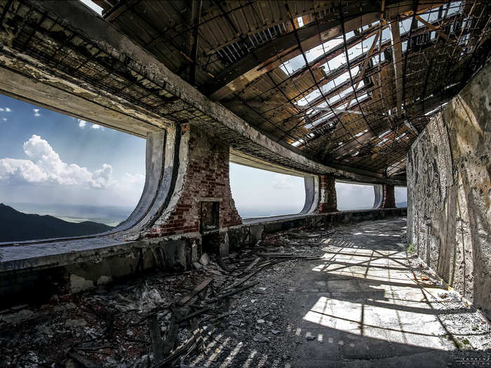 The windows may all be gone, but the outer corridors provide an unparalleled view of the surrounding Balkan mountains.