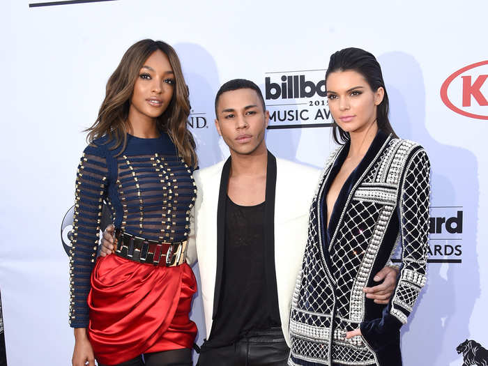 Model Jourdan Dunn, designer Olivier Rousteing, and model Kendall Jenner, all wearing Balmain x H&M.