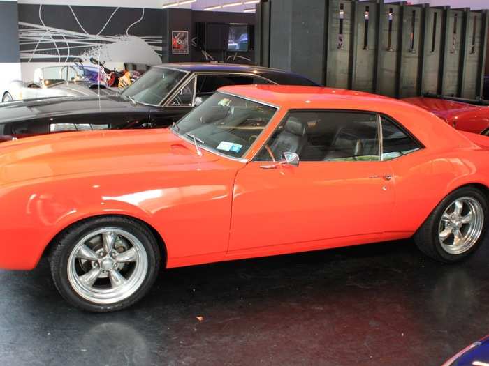 The orange 1968 Chevy Camaro SS is the brightest car in the bunch.