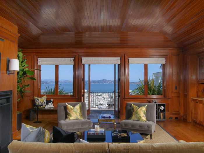 A gorgeous wood-paneled office has a spacious terrace that looks out over the Bay.