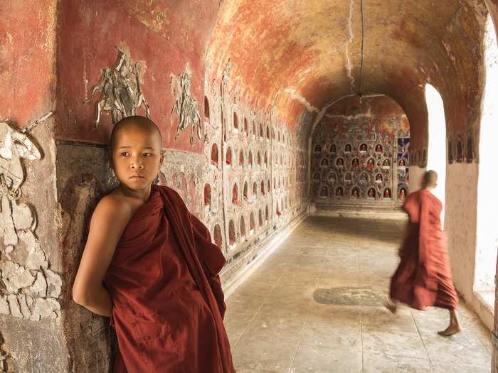 A young monk at the Shwe Yan Pyay monastery in Nyaung Shwe, Myanmar. The monastery was built in the 1800s and is richly decorated with mosaics and golden ornaments.