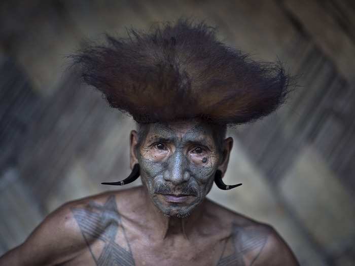 This man is a Konyak, a tribe located in northeast India and Myanmar. They are recognized by their tattoos, which they have all over their bodies. Facial tattoos are earned for taking an enemy