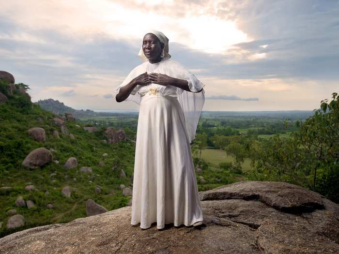 This woman is meditating on Kit Mikayi, a rock formation more than 130 feet tall in Kenya.