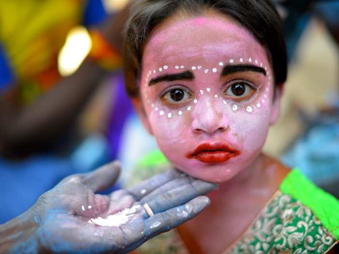 Every year, the small town of Kaveripattinam in India celebrates the Angalamman Festival. Tens of thousands of devotees converge on the town to worship the "Guardian God," Angalamman. Some worshippers paint their faces to personify the goddess Kali, while others pierce iron rods through their cheeks.