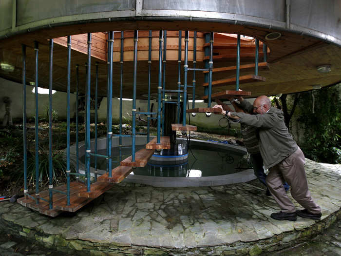 Seventy-three-year-old builder Bohumil Lhota constructed a home in Velke Hamry, Czech Republic, that is able to move up and down and rotate on its sides. It took him nearly 20 years to create. Here, Lhota is seen "turning" the house for a preferred window view.