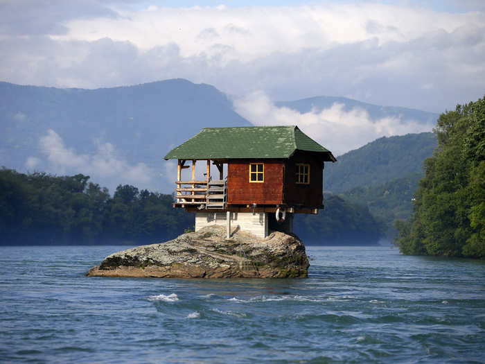 This house is built on a rock on the river Drina, near the western Serbian town of Bajina Basta. It was built in 1968 by a group of young men who decided that the rock on the river was an ideal place for a tiny shelter, according to the house