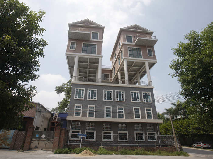 Not to be outdone by the previous Chinese sky high dwellings, these precarious-looking houses were built on the rooftop of a factory building in in Dongguan, China. The houses were completed two years ago. According to local media, the government said the size of the houses was not in line with the original design submitted, thus the construction should be deemed illegal.